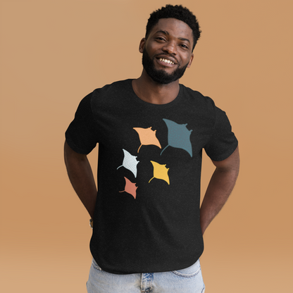 A smiling man wearing a black t-shirt with a graphic of colorful fish on it.