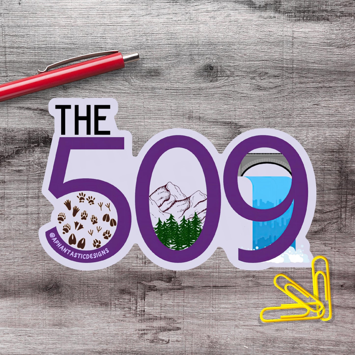 a sticker with the number "509" and various illustrations, including a mountain, a waterfall, and a city skyline.