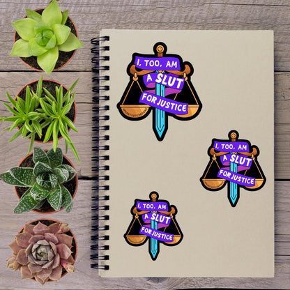 a spiral notebook with stickers on it, along with several potted plants arranged on a wooden surface.