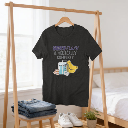 a black t-shirt with a humorous graphic design, hanging on a wooden hanger in a bedroom setting.