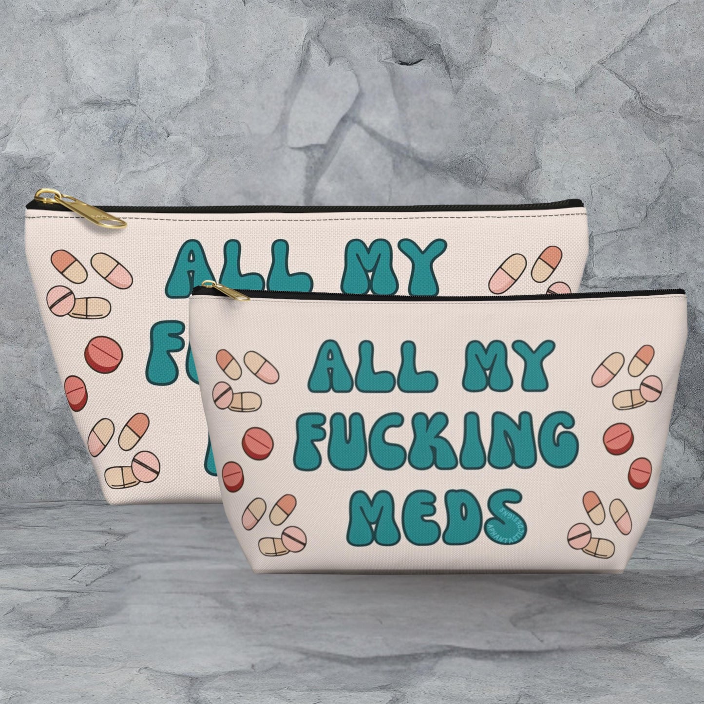 two white cosmetic bags with teal and pink text and illustrations of pills.