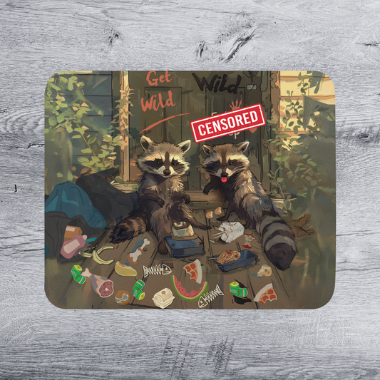 Two raccoons sitting on a wooden surface, surrounded by various food items such as bananas, pizza, and a sandwich. A red sign with the text "Get wild" is visible, and the raccoons appear to be enjoying a meal.