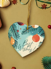 A heart-shaped ornament with a blue background and Christmas ornaments hanging from it, along with some star-shaped decorations and a ribbon.