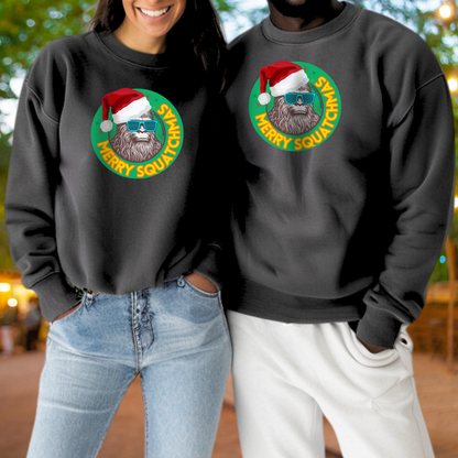 A woman and a man are standing together, both wearing black sweatshirts with a graphic of a Santa Claus beard and glasses.