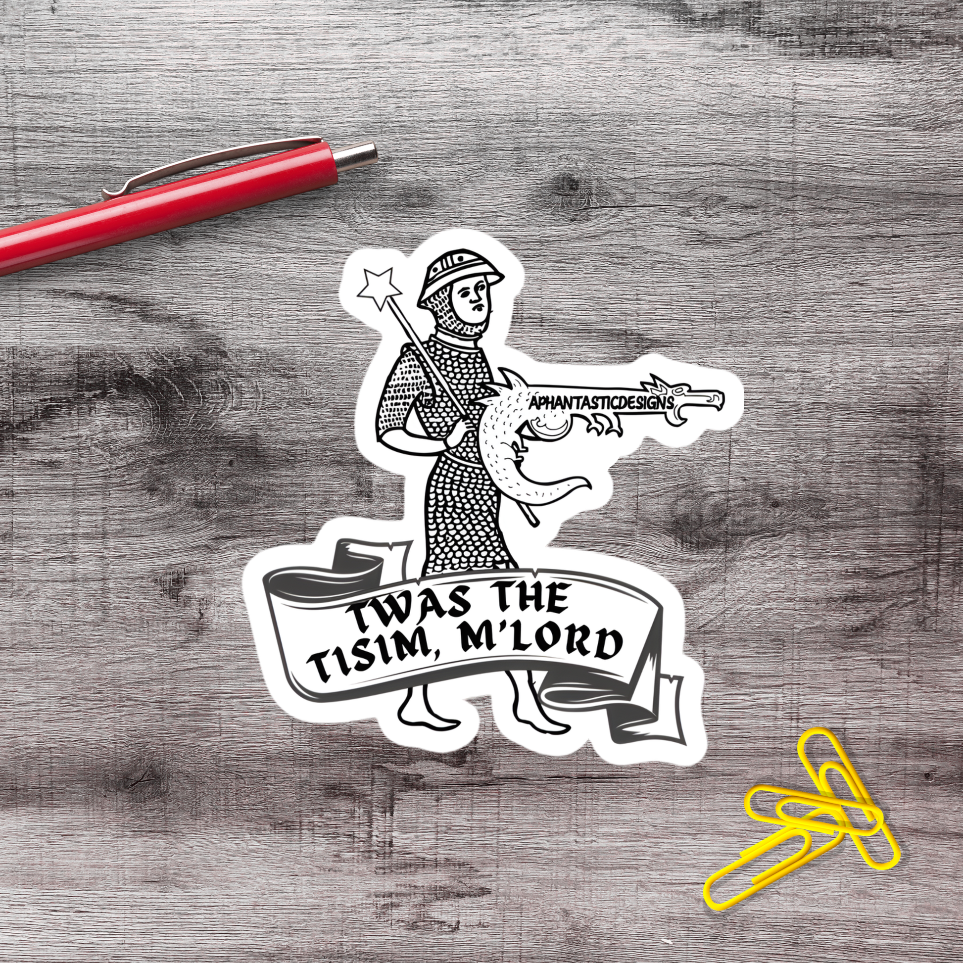 A sticker depicting a knight holding a sword and shield, with the text "TWAS THE TISIM, M LORD" written on a banner below.