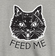 A gray sweatshirt with a black cat graphic and the text "FEED ME" printed on it.