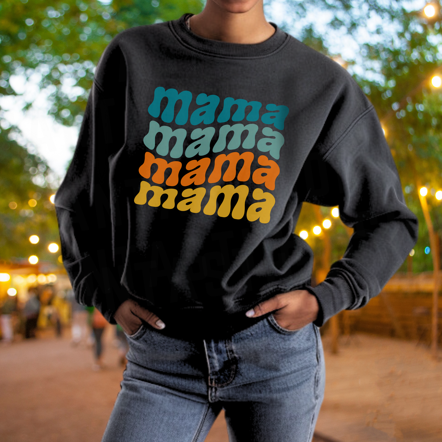 A person wearing a black sweatshirt with the text "mama mama mama" printed on it.