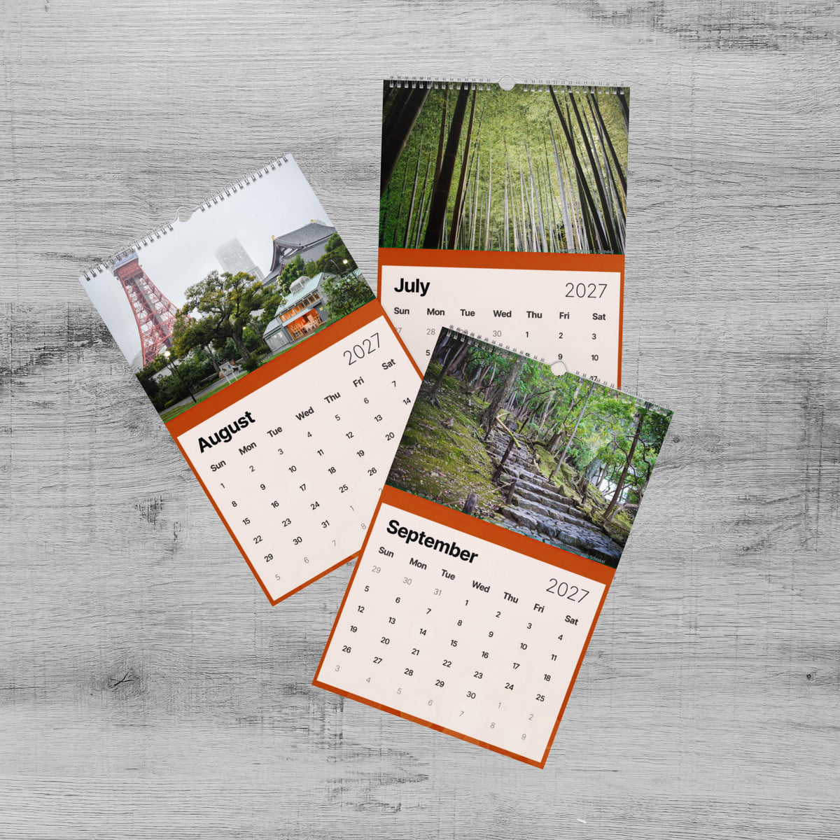 The image is a three-page calendar with a collage of different images, including a red tower, a forest, and a beach.