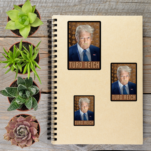 a spiral notebook with three stickers on it, each depicting a man wearing a suit and tie. The stickers are arranged on the notebook, and there are several potted plants placed around the notebook and stickers.