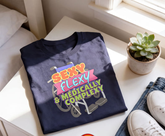 a blue t-shirt with a colorful graphic design, a potted succulent plant, and a pair of white sneakers on a white surface.