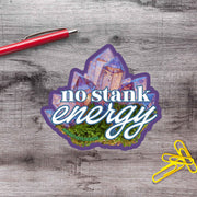 a sticker with the text "no stink energy" and an illustration of a crystal or gemstone.