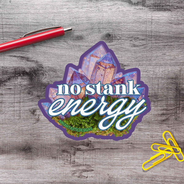 a sticker with the text "no stink energy" and an illustration of a crystal or gemstone.