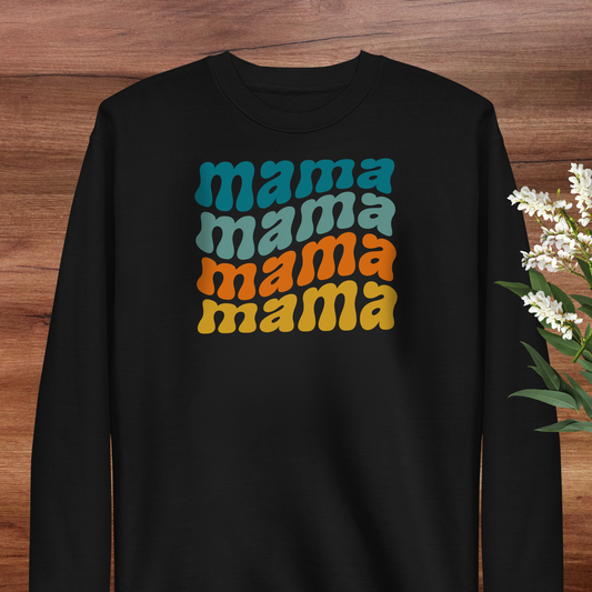 A black sweatshirt with a colorful graphic design on the front, featuring the text "mama mama mama" in a retro style.