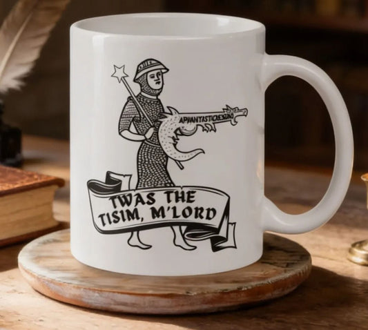 A white mug with a black and white illustration of a knight holding a sword and shield, along with the text "TWAS THE TISIM, M'LORD" printed on it.