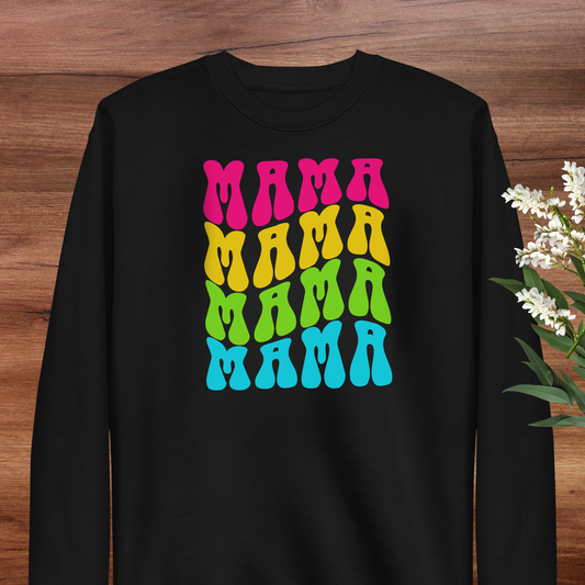A black long-sleeved shirt with a colorful graphic design featuring the word "MAMA" repeated in a vibrant, retro-style font.