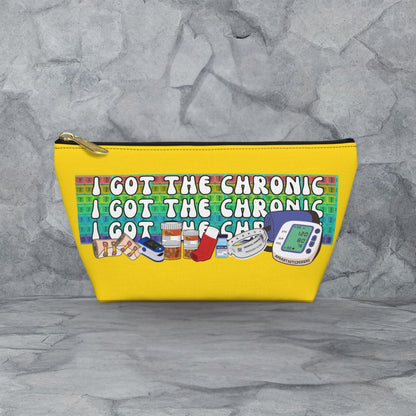 A yellow cosmetic bag with a printed message on it.