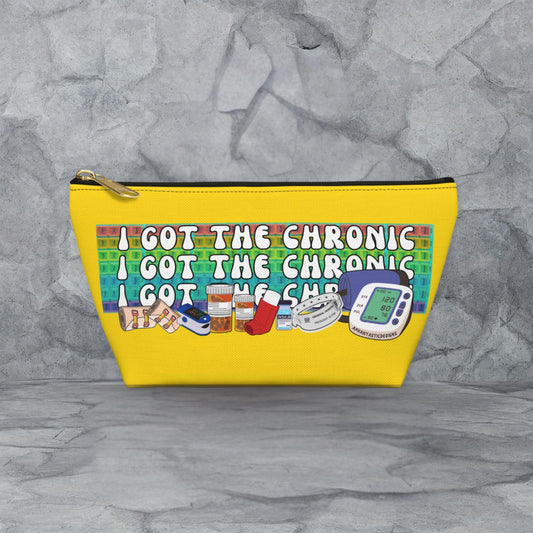 A yellow cosmetic bag with a printed message on it.