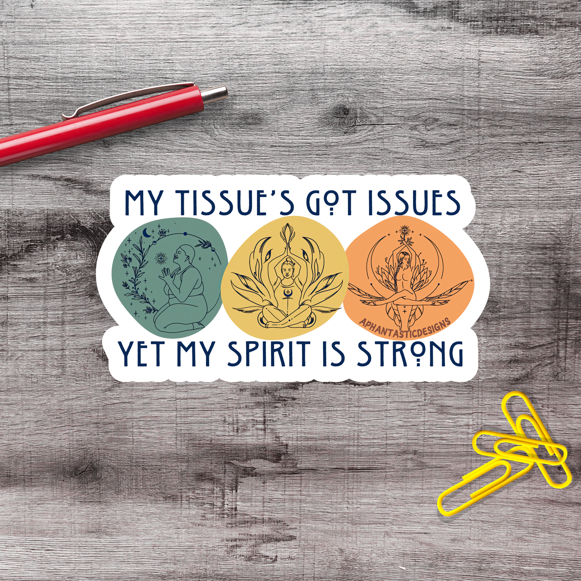 A sticker with the text "MY TISSUE'S GOT ISSUES YET MY SPIRIT IS STRONG" and three circular illustrations, one of which is a person in a meditative pose.