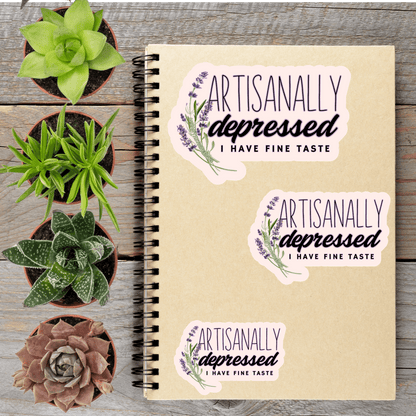 a notebook with stickers on it, surrounded by four potted plants.