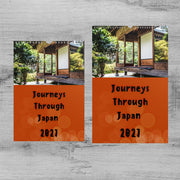 The image is a calendar featuring a photograph of a traditional Japanese building surrounded by trees. The calendar is divided into two sections, with the left section displaying the text "Journeys Through Japan" and the right section displaying the text "Journeys Through Japan" and the date "2821".