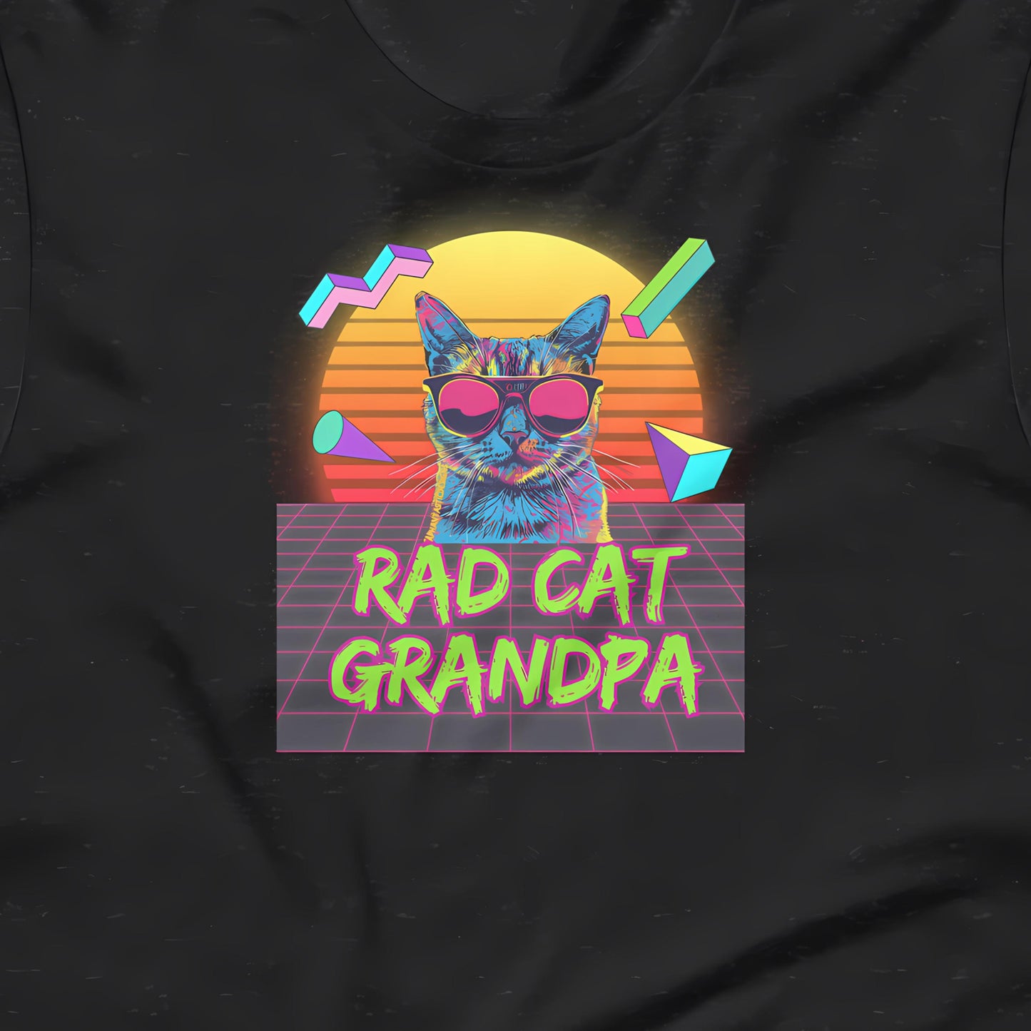 A black t-shirt with a graphic design featuring a cat wearing sunglasses and surrounded by geometric shapes, with the text "RAD CAT GRANDPA" below.