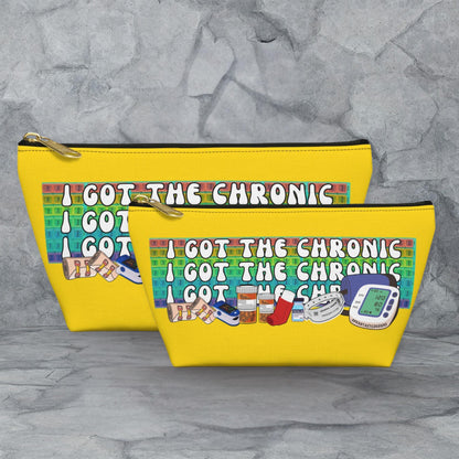 Two yellow tote bags with a colorful graphic and text printed on them.