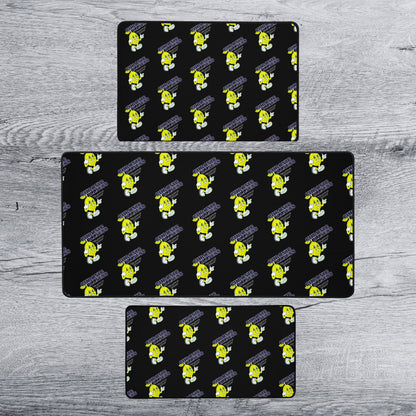 three identical black rectangular mats with a repeating yellow cartoon character pattern on them.