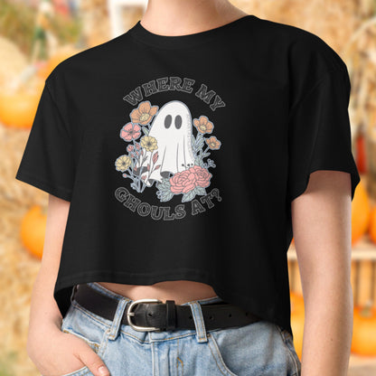 A person wearing a black t-shirt with a graphic design featuring a ghost surrounded by flowers and the text "WHERE MY GHOULS AT?"