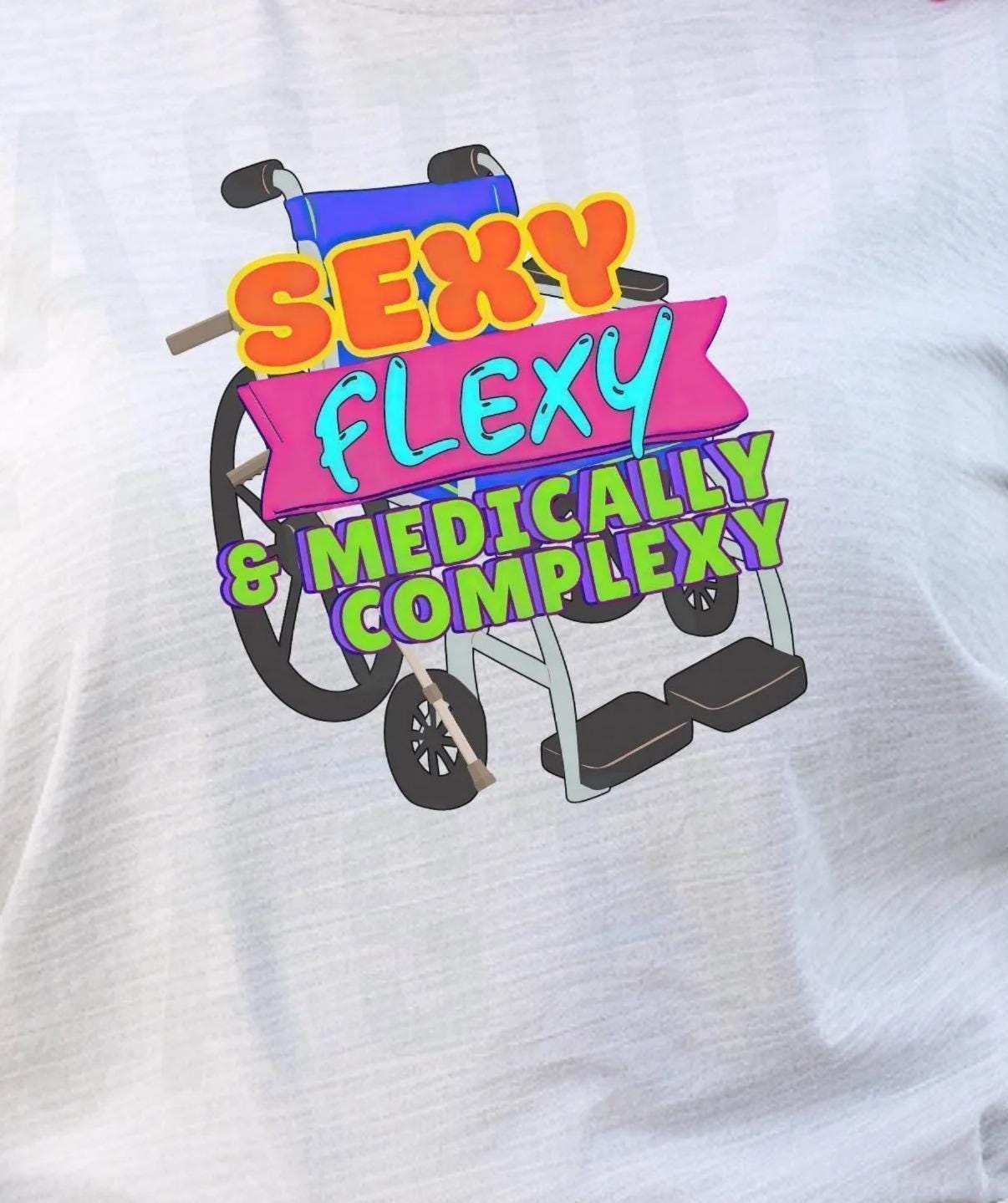 A person with tattoos on their arms and legs is wearing a gray t-shirt with a colorful graphic design on it.