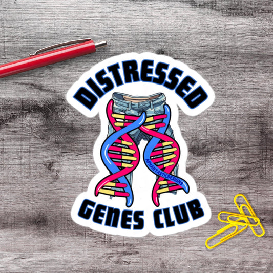 a sticker with the text "DISTRESSAED GENES CLUB" and an illustration of a pair of jeans with a DNA helix. There is also a red pen and a pile of yellow paper clips on a wooden surface.