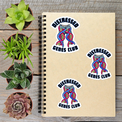 a notebook with three stickers on it, along with several potted plants arranged around it.