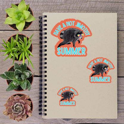 a spiral notebook with stickers on it, surrounded by various potted plants on a wooden surface.