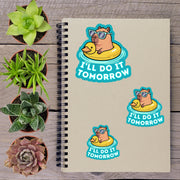 a spiral notebook with stickers on it, along with several potted plants arranged on a wooden surface.