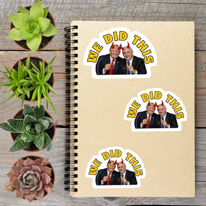 a spiral notebook with stickers on it, along with several potted plants arranged on a wooden surface.