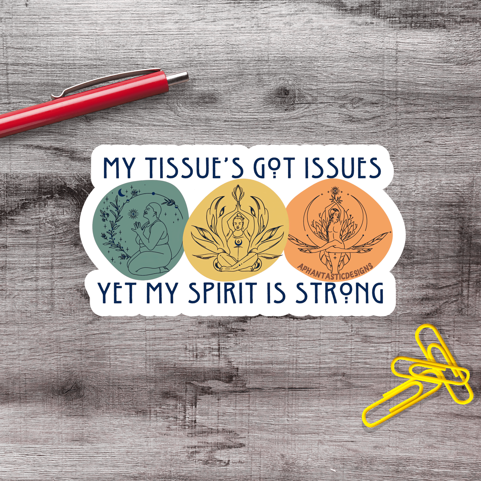 A sticker with the text "MY TISSUE'S GOT ISSUES YET MY SPIRIT IS STRONG" and three circular illustrations, one of which is a person in a meditative pose.