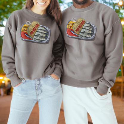 Two people wearing matching gray sweatshirts with a graphic of a can of sardines.