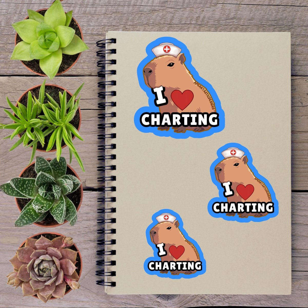 a notebook with stickers on it, surrounded by potted plants.