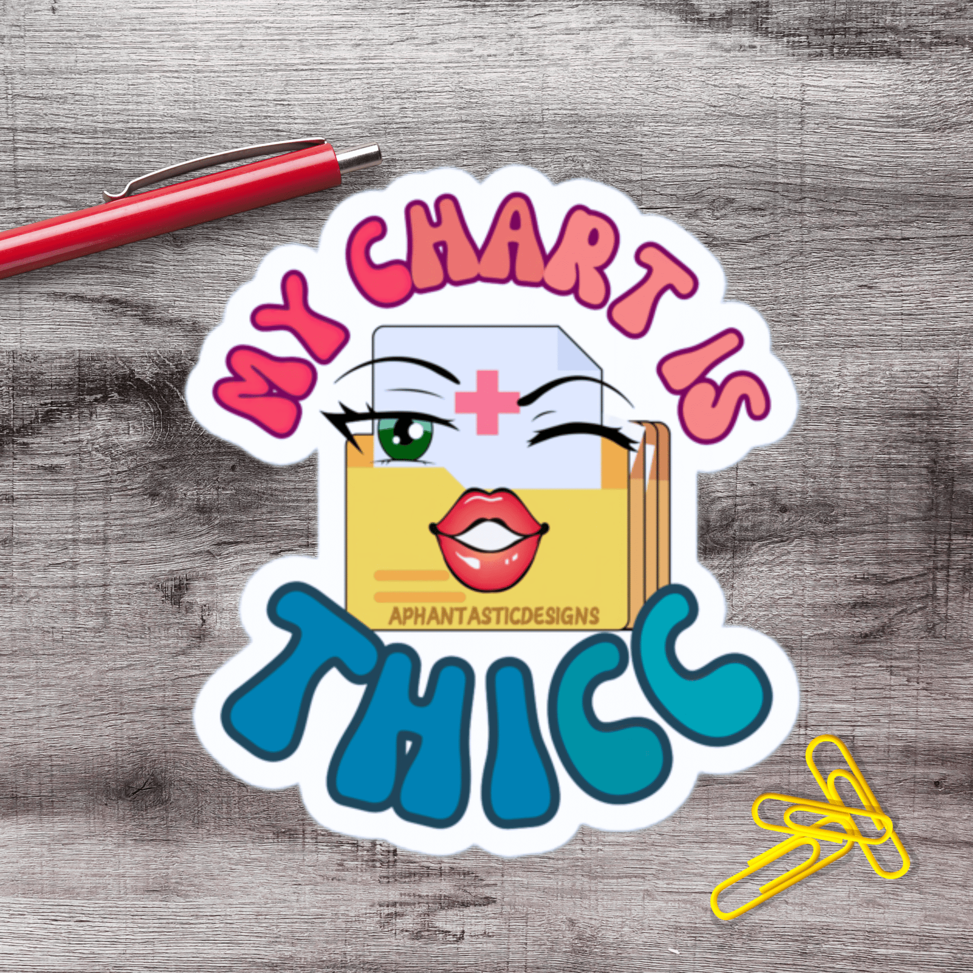 A sticker with a cartoon character and the text "MY CHART IS THICK" on a wooden surface.